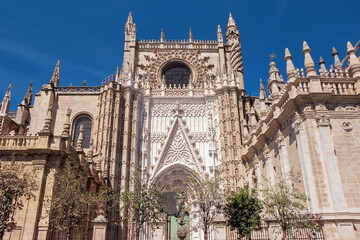 exterior architecture of Cathedral church in Seville, Spain - 744583190