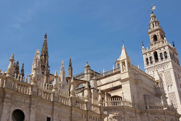 exterior architecture of Cathedral church in Seville, Spain - 744583529
