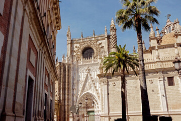 exterior architecture of Cathedral church in Seville, Spain - 744583985