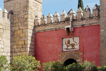 entrance gate at Alcazar royal palace in Seville, Spain - 744584104