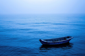 Fototapeta premium Small boat floating peacefully on calm waters