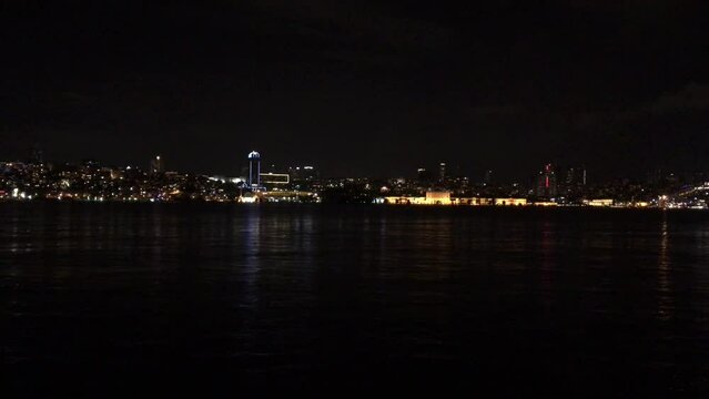 Walking along the Bosporus at night towards July 15 Martyrs Bridge