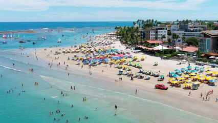 Porto de Galinhas Beach. The sea and the great reef that faces it create natural water pools. These spaces have pools where you can swim and be surrounded by thousands of fish. Brazil.
