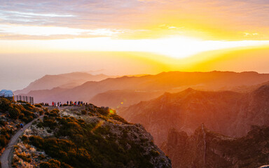 Beautiful sunrise in Madeira highest mountains range. Hiking trial from Pico do Areerio to Pico do Ruivo. Madeira, Portugal