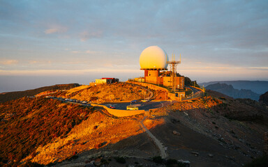 Fototapeta na wymiar View of the observatory on top of the Pico do Arieiro during sunrise or sunset. Portugal, Madeira