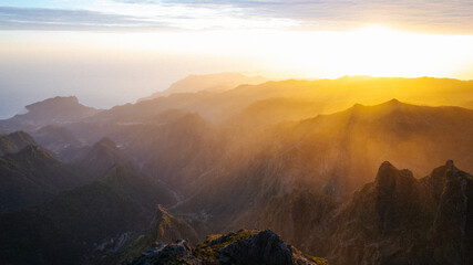 Beautiful sunset or sunrise in Madeira mountains with beautiful lights on peak Pico do Areeiro or...