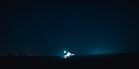 A house at night over clear sky