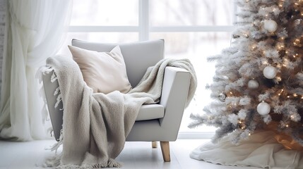 White snuggle chair with woolen blanket near decorated christmas tree winter holiday home interior design of modern living room