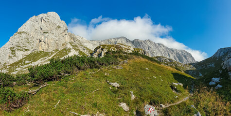 Panoramic view of majestic mountain peaks of Hochschwab massif, Styria, Austria. Idyllic hiking trail on high altitude alpine terrain, remote Austrian Alps in summer. Sense of escape. Nature lover