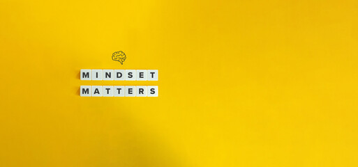 Mindset Matters Phrase and Banner. Concept of Growth Mindset, Positive Attitude, Self-awareness, Open-mindedness. Text on Block Letter Tiles and Brain Icon on Yellow Background. 