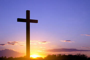 Cross against the sunset. Good Friday or Easter concept