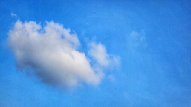 a painting of a cloud in the blue sky