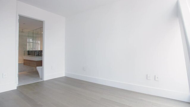 Panning shot of an empty bedroom in a New York City luxury apartment