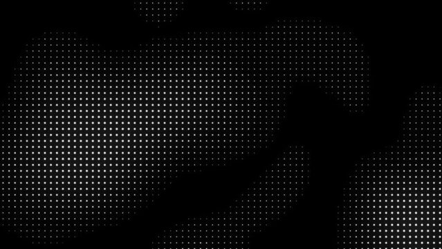 Dynamic white dots of chaotic shapes on a black background. 4k video for your project.