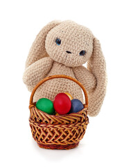 Toy bunny and basket with Easter eggs.
