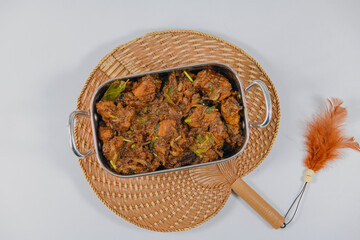 Sukha mutton or chicken, dry spicy Murgh or goat meat served hot,  mutton fry, special hot spicy traditional dish. Buffalo roast, meat pepper fry. Top view South Indian non veg food side dish Rice