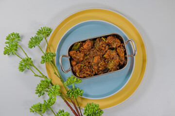 Sukha mutton or chicken, dry spicy Murgh or goat meat served hot,  mutton fry, special hot spicy traditional dish. Buffalo roast, meat pepper fry. Top view South Indian non veg food side dish Rice