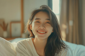 Portrait of young smiling beautiful Asian woman wake up in the morning