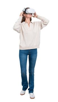 Young smiling woman full length wearing vr glasses headset, isolated over white background, digital world and vision. Concept of metaverse, innovation and immersive