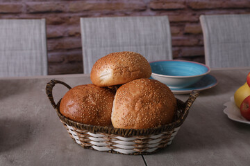 basket of fresh bread on a dining table