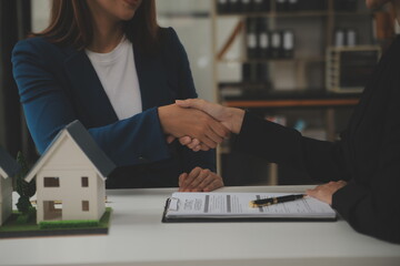 Business Signing a Contract Buy - sell house, insurance agent analyzing about home investment loan...