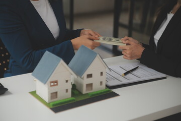 Business Signing a Contract Buy - sell house, insurance agent analyzing about home investment loan Real Estate concept.