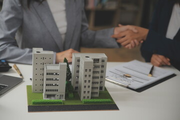 Business Signing a Contract Buy - sell house, insurance agent analyzing about home investment loan Real Estate concept.