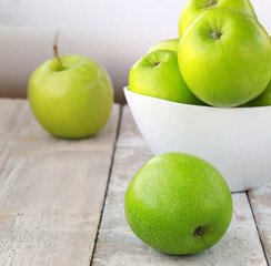 organic granny smith apples on wooden table