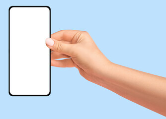 Female hand holding phone with blank screen on blue background