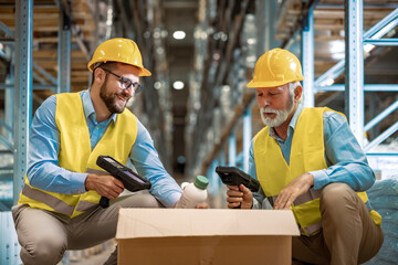 Warehouse workers scanning box - 744661133
