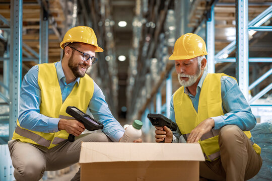 Warehouse workers scanning box