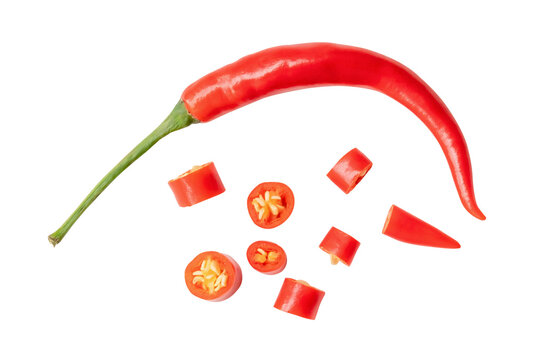 Top view and flat lay of single fresh curved red chili pepper with slices isolated with clipping path in png file format