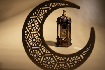 Ramadan Mubarak, vintage lantern with moon, natural background, Arabic culture
