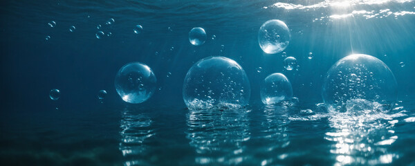 Shimmering aqua spheres filled with air float amidst glistening water droplets clinging to the glass