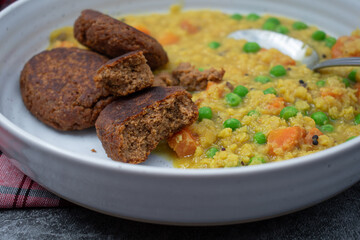 Vegan cutlets made of seitan. White plate.