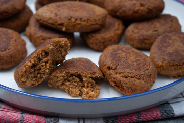 Vegan cutlets made of seitan. White plate, close up.
