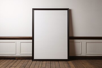 Blank framed image on the background of the wall wooden floor space for your own content.