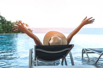 Holiday relaxation vacation of woman take it easy, happy life quality, resting on beach chair at...