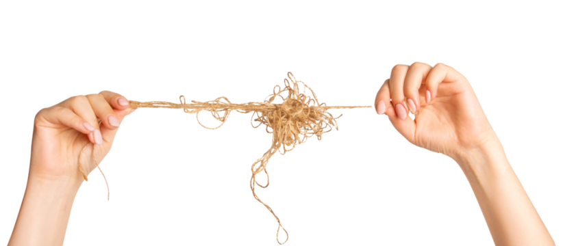 female hands stretch a wound ball of thread. On an empty background.