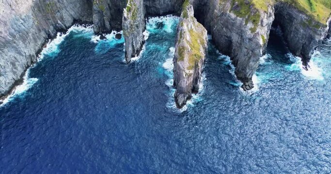 Aerial view of rocks coastline in Azores. Cliffs of San Miguel Acores island. Aerial view of Atlantic ocean coastline 4k.