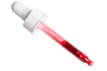 Pipette with red liquid acids, or serum. On a blank background