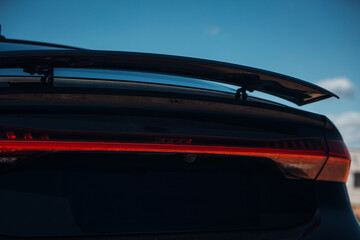 Active aerodynamic system spoiler on the trunk of modern car