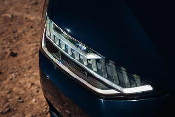 Headlight of modern car close up