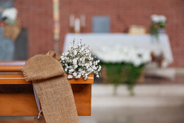 Whte flowers in a Catholic Church