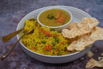 Rice pilaf with sambar- lentil and vegetables gravy, along with papad