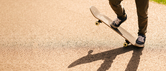 Close up photo of teenager boy on skateboard. © Vulp