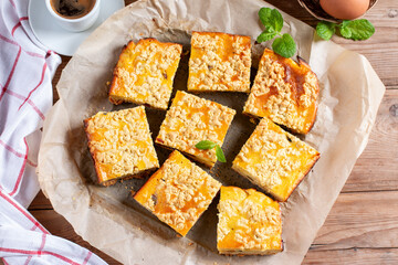 Slice of fresh homemade cottage cheese cake on table. Flat lay.
