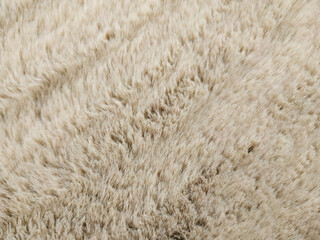 Bedding, carpet with a fluffy fur plaid. Copy space. Flat lay, top view.