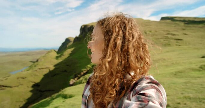 Video call, nature and excited woman on holiday for hiking on a mountain in Sweden. Blowing kiss, selfie and happy female person on outdoor adventure with freedom and waving hello for greeting