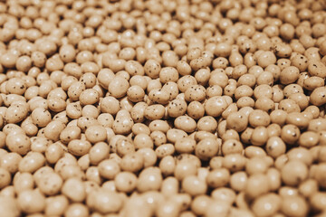 brown dragee with cocoa. chocolate dragee. dragee with nuts. sweet shop